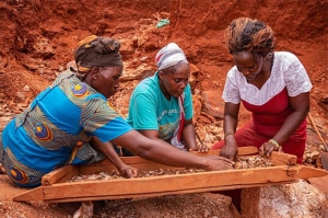 Women sorting gemstones in an artisanal mining site